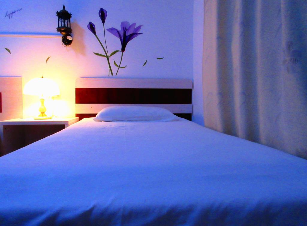 25°C Four Season Youth Hostel Qingdao Zimmer foto